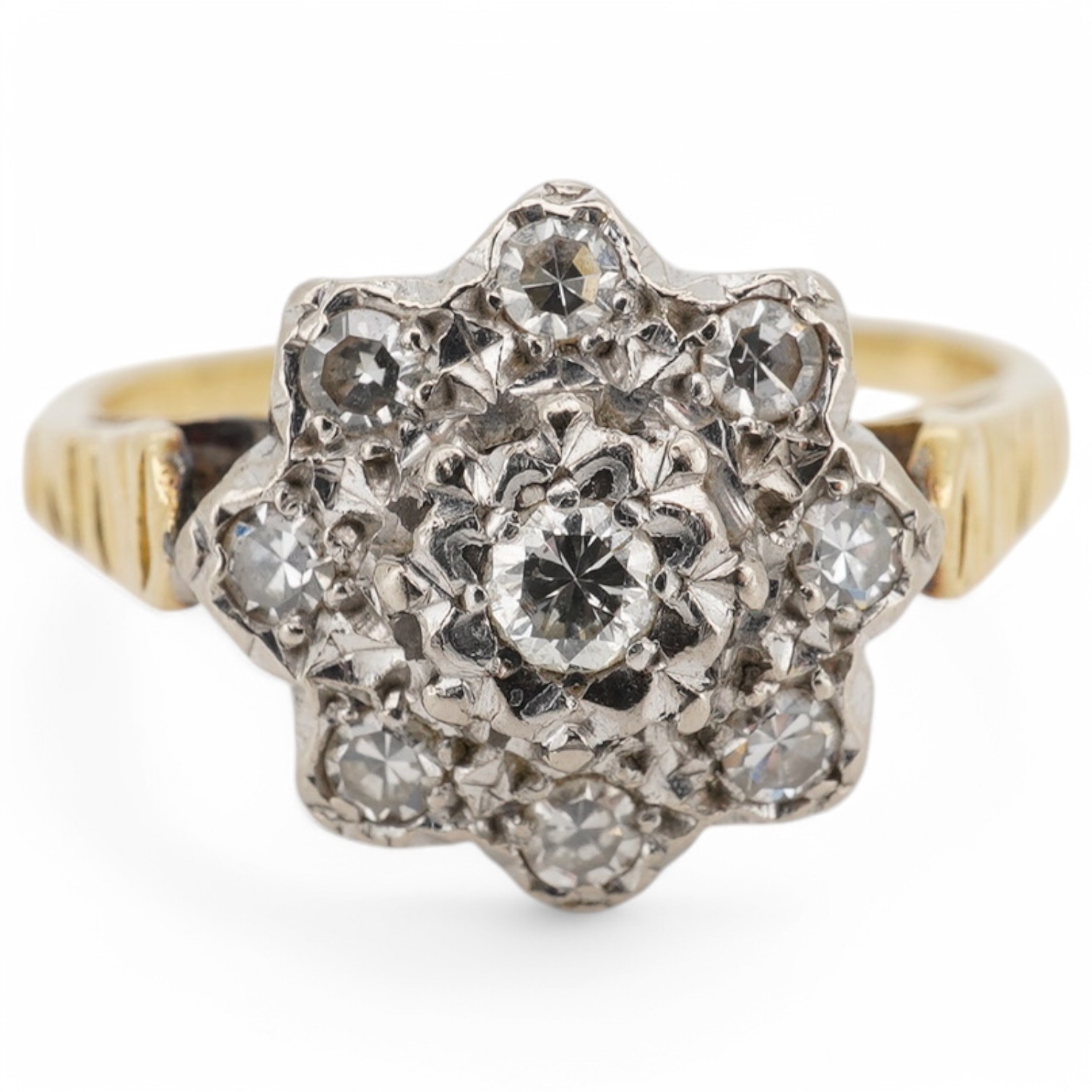 An 18ct and illusion set diamond cluster ring, size M/N, gross weight 3.6 grams. Condition - fair